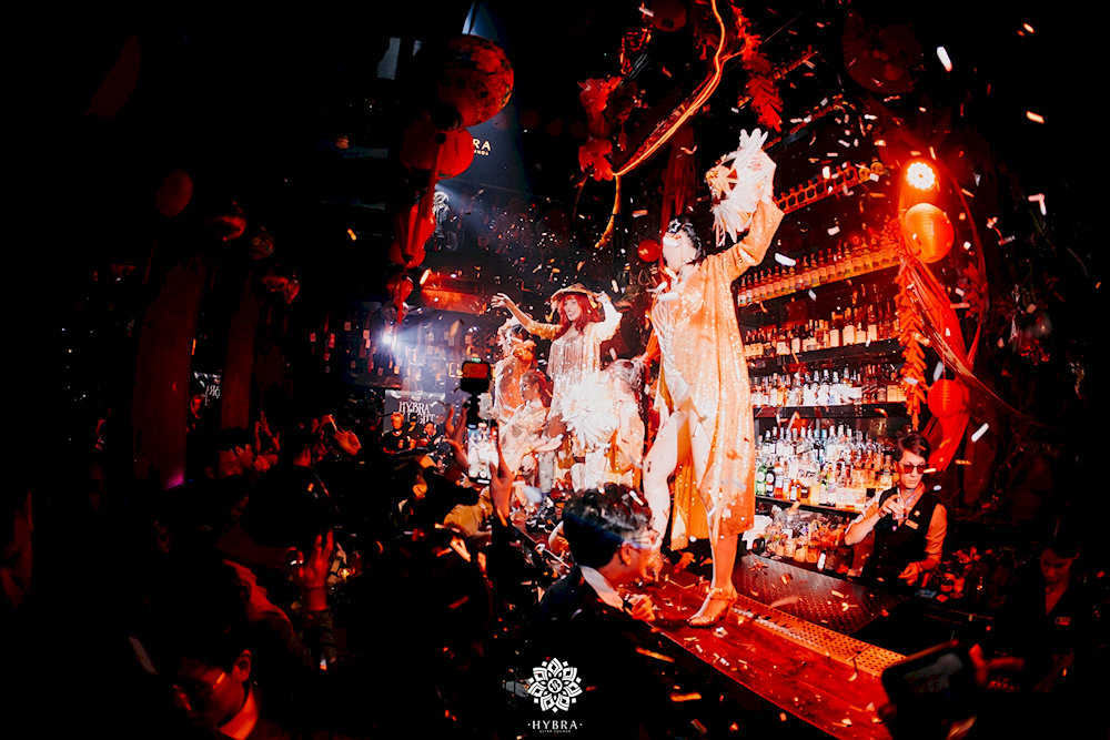 The bar area doubles as a stage for dancers and artists, creating a truly unique experience